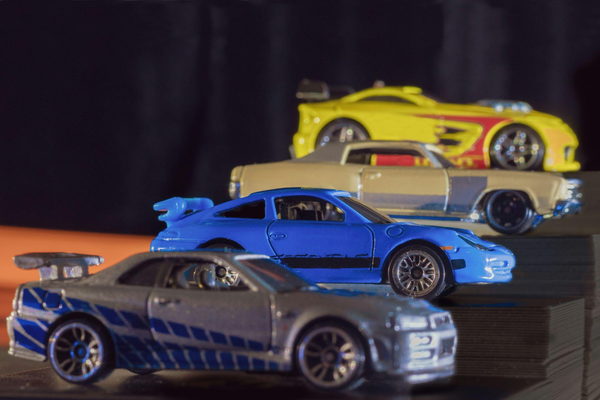 RC cars lined up on a racing track